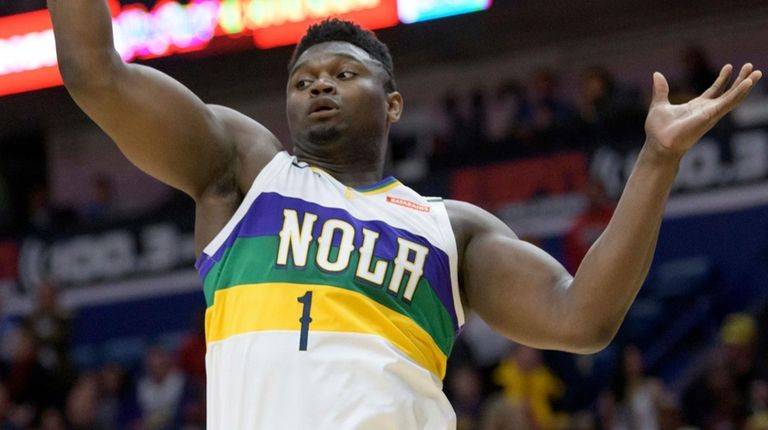 Pelicans forward Zion Williamson grabs a rebound during