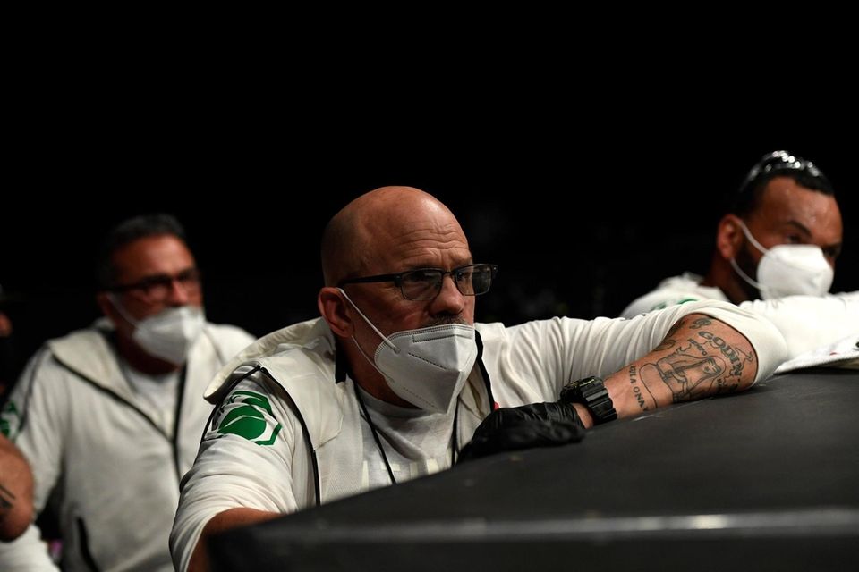 Team members look on in the Light Heavyweight