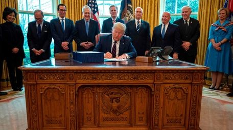 PresidentTrump signs the CARES act, a $2 trillion