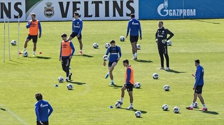 Players of Bundesliga soccer club Schalke 04 exercise