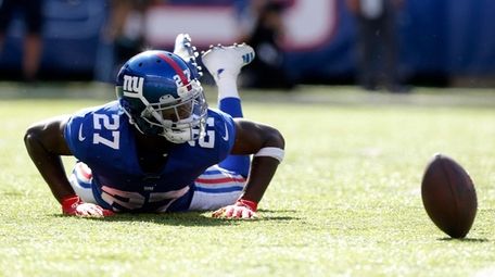 DeAndre Baker of the Giants looks on after