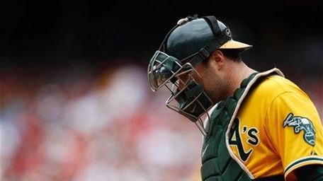 Oakland Athletics catcher Landon Powell walks to the