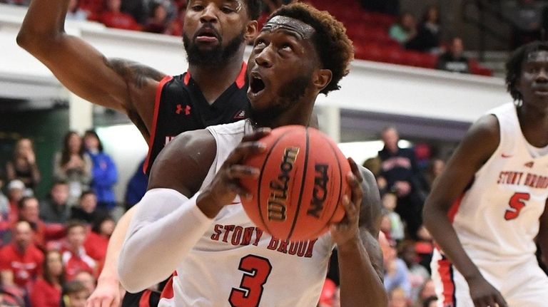 Stony Brook guard Elijah Olaniyi looks to shoot