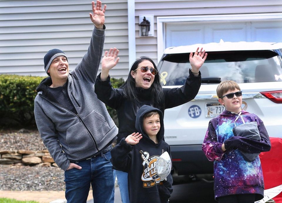 Seven-year-old Ryan Starace, center, is joined by his
