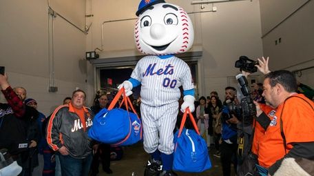 Mr. Met helps load the truck going to