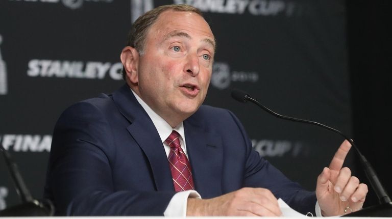 NHL Commissioner Gary Bettman speaks with the media