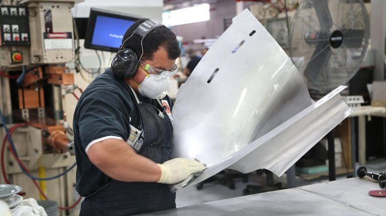 A spot welder cleans a section of the