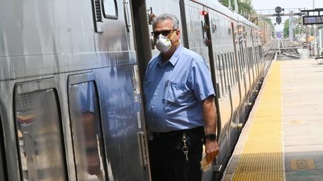 A Long Island Rail Road conductor wears a