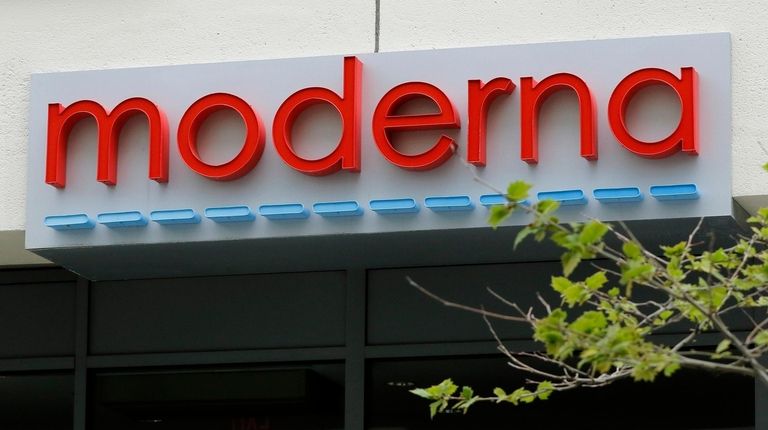 A sign marks an entrance to a Moderna,