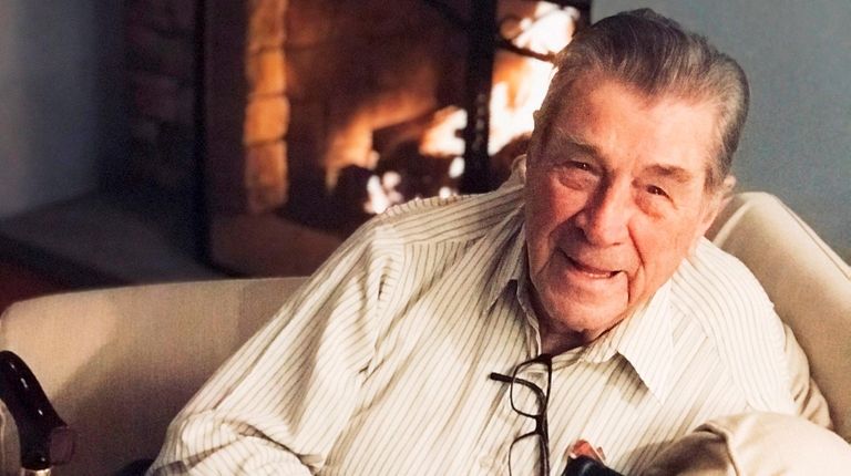 John Tomlin, of West Islip, played golf until