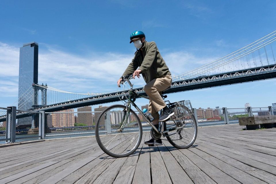 A person rides a bicycle along the East