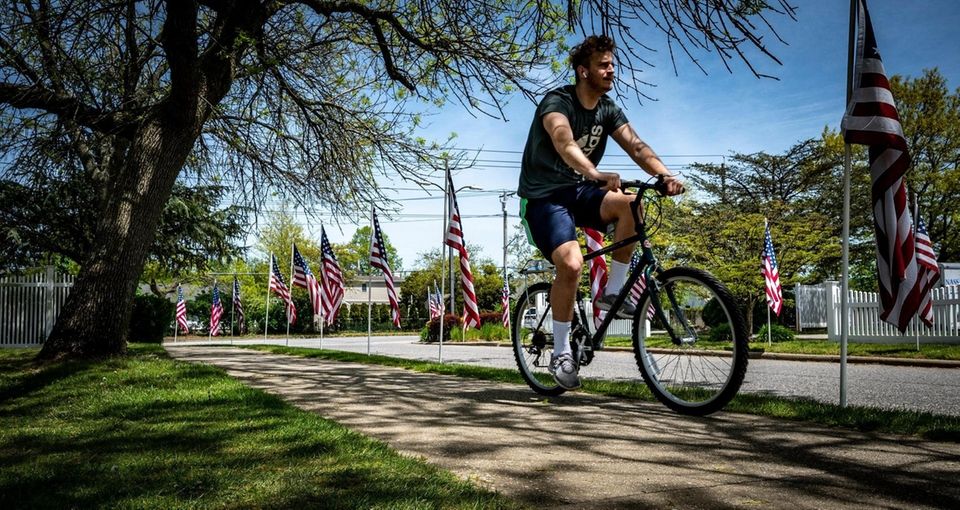 People running, walking and biking through John J.