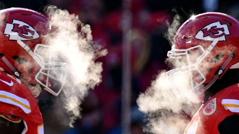 Kansas City Chiefs players' breath masks their faces