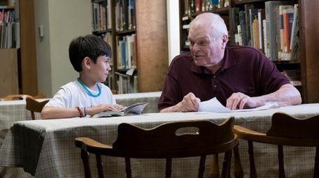 Lucas Jaye, left, as Cody and Brian Dennehy