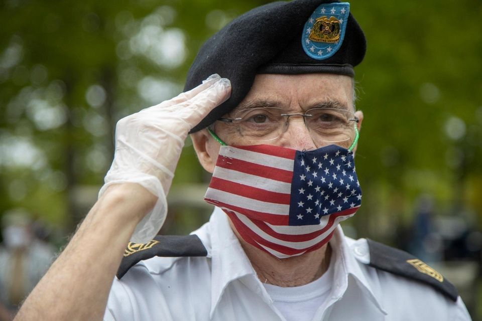 Anthony Cipriano, Floral Park, salutes as the Nassau