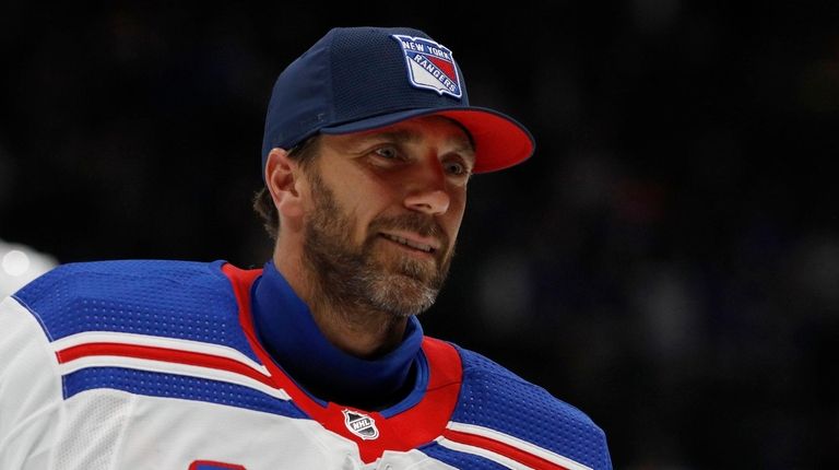 Henrik Lundqvist skates off the ice after a