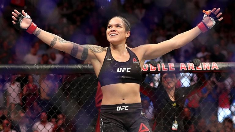 Champion Amanda Nunes reacts after defeating Holly Holm