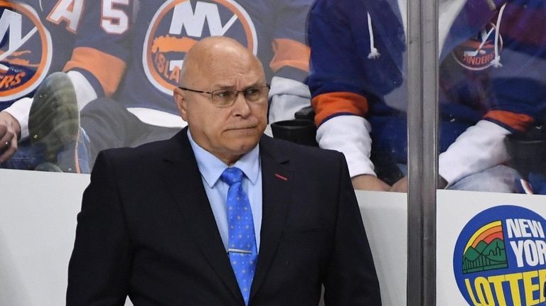 Islanders head coach Barry Trotz looks on against