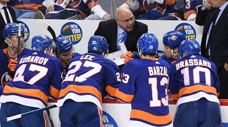 Islanders head coach Barry Trotz directs his players