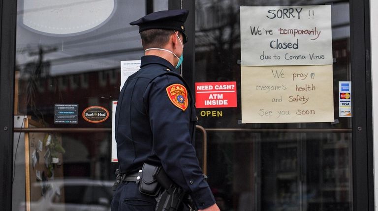 A Suffolk County probationary police officer walks down