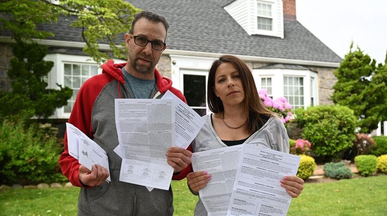 Doug and Marlo Goodstein hold Baldwin absentee ballots