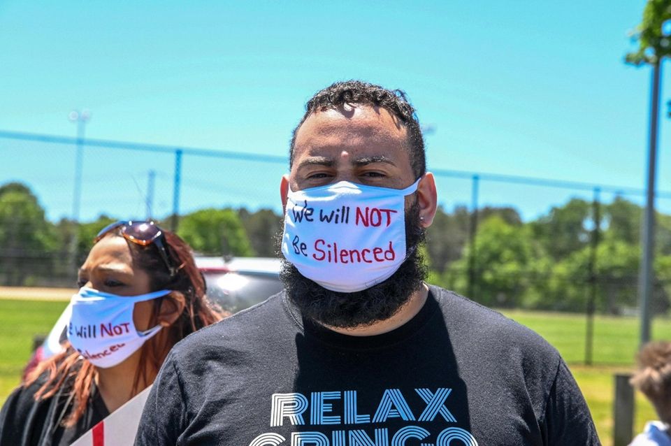 A man attends a rally at Stotzky Park