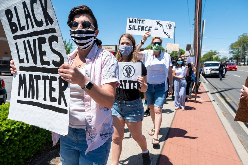 Protesters gather on South Oyster Bay Rd. as