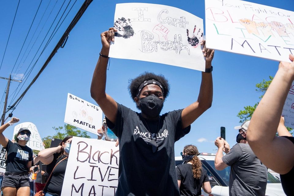 Protesters gather on South Oyster Bay Rd. as