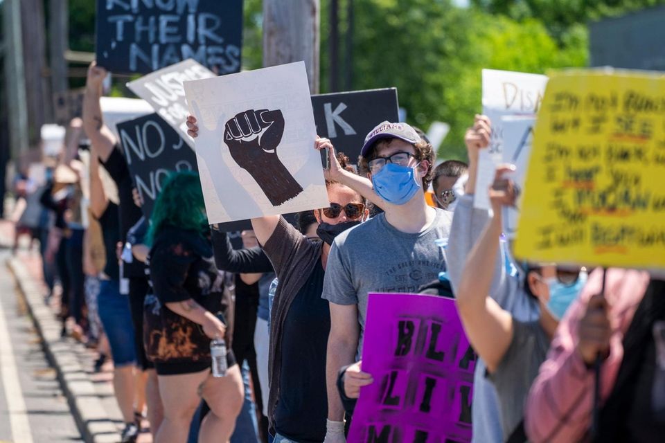 Protesters gather on South Oyster Bay Rd. as