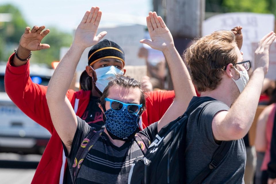 Protesters gather on South Oyster Bay Rd. as
