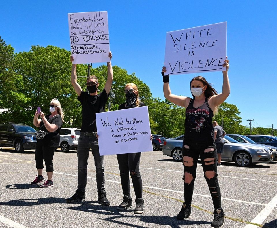 People attend a rally at Stotzky Park in