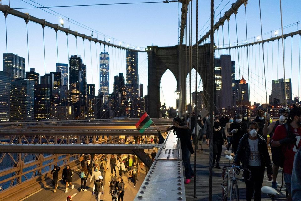 Demonstrators march from Manhattan over the Brooklyn Bridge