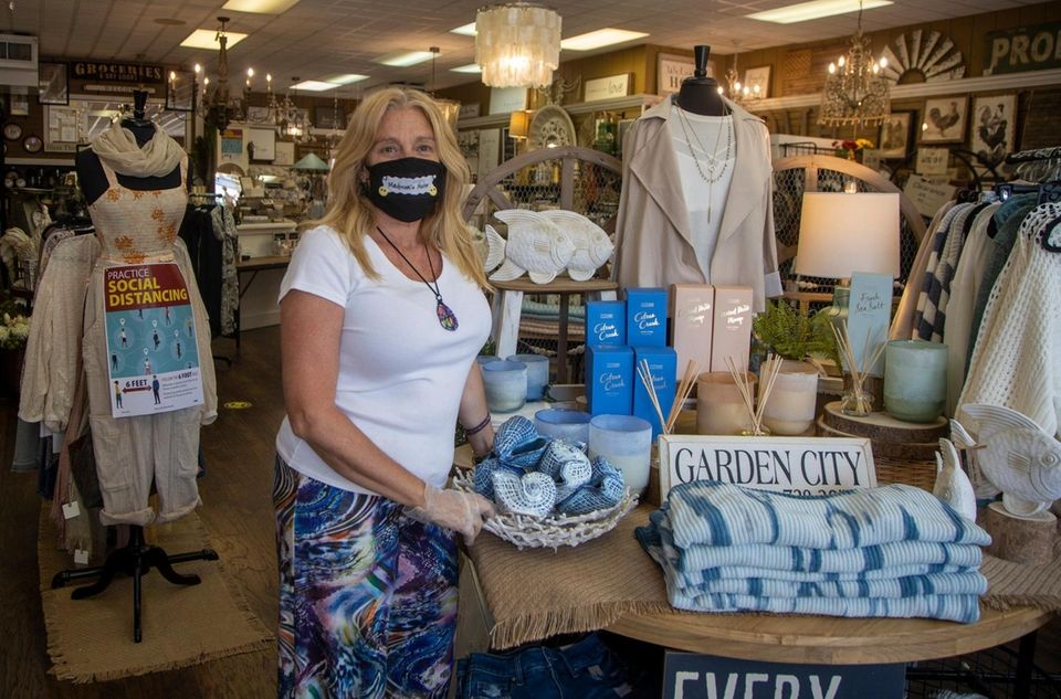 Janice Corio, manager of Madison's Niche, stands in