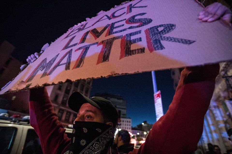 A sign reading "black lives matter" during continuing