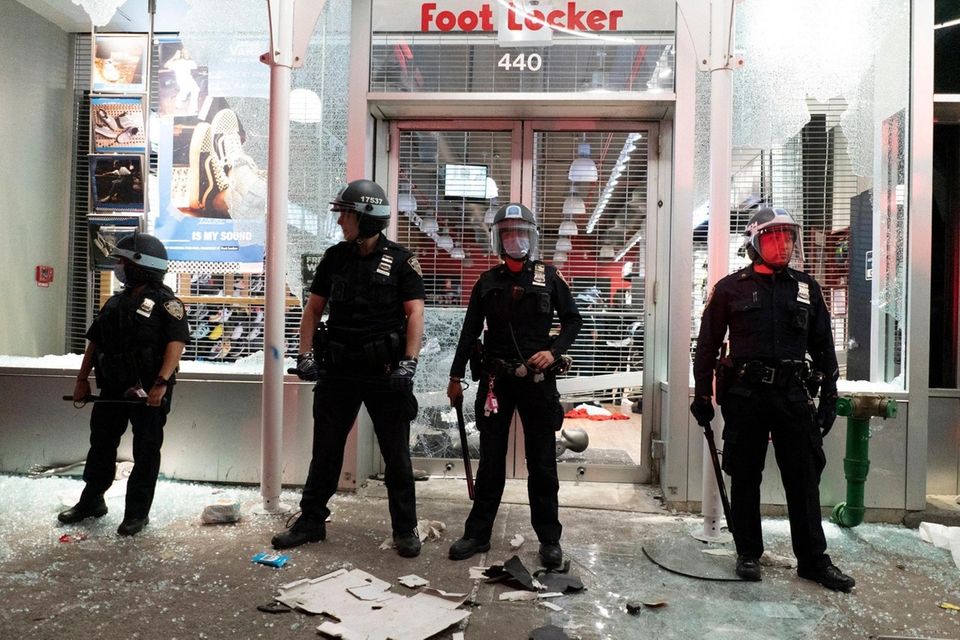 Members of the NYPD stand in front of