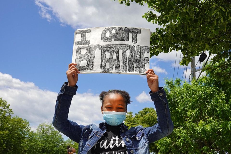 Stori Julien, 11, of Greenlawn joins a peaceful