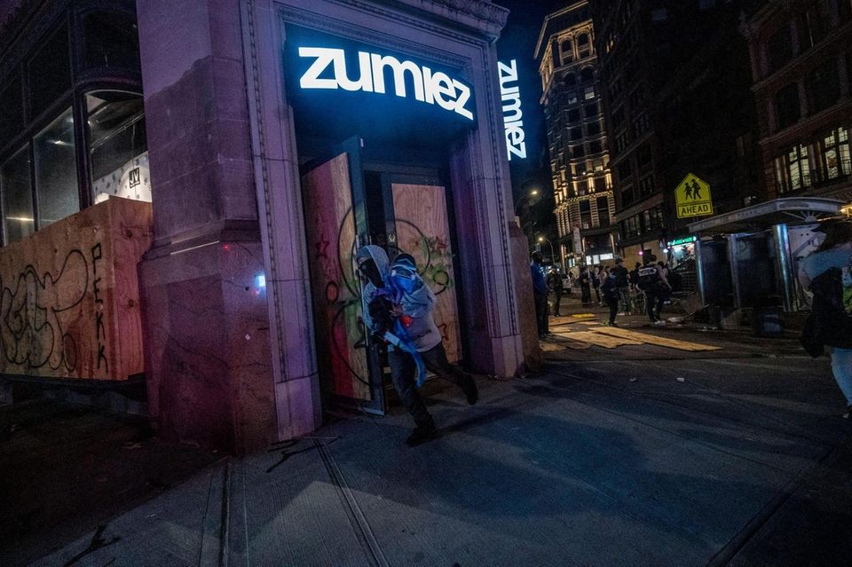 People run out of stores on Broadway with