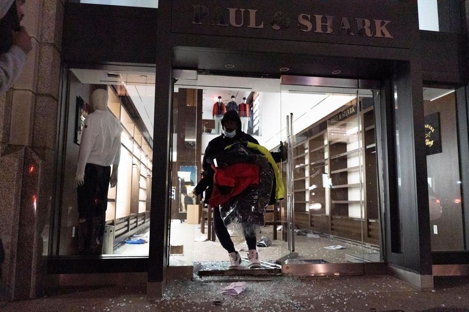 A person runs out of a store with