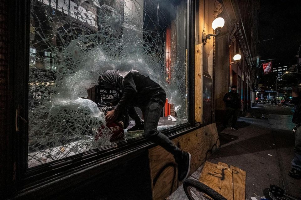 People run out of stores on Broadway with
