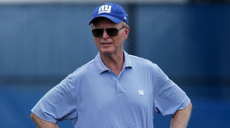Giants president and CEO John Mara watches training