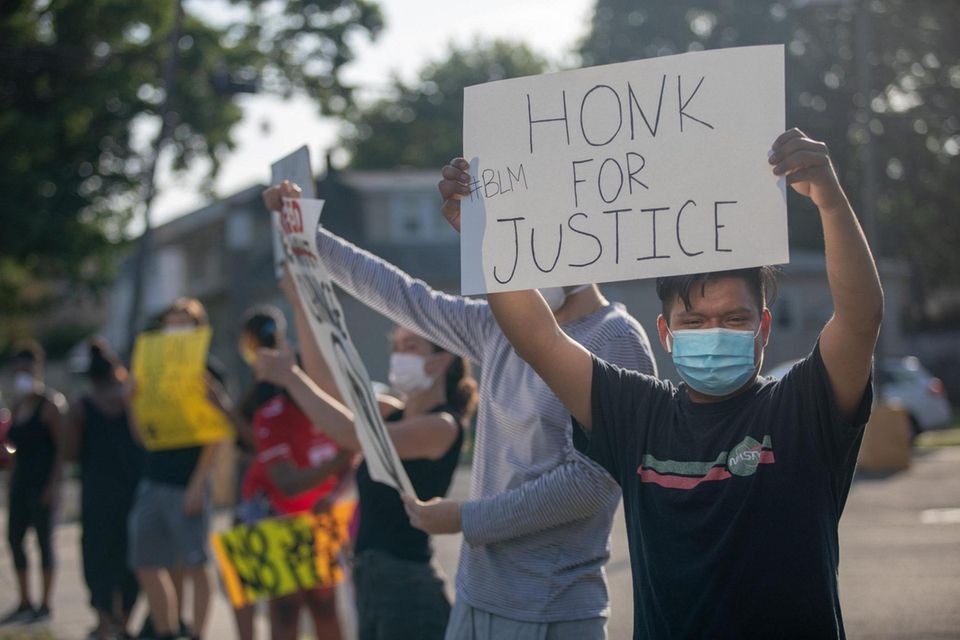 Protesters gather on Front Street in Uniondale to