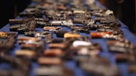 A table of illegal firearms confiscated in a