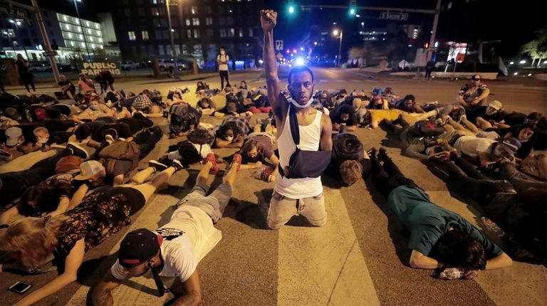 Protesters lay in the middle of the intersection