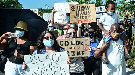 Protestors March up Straight Path in Wyandanch in