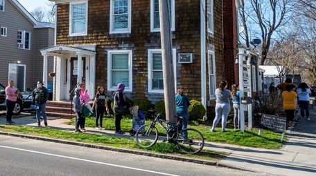 People line up to receive food assistance and