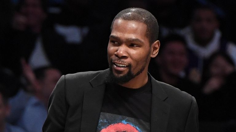 Nets' Kevin Durant looks on during the first