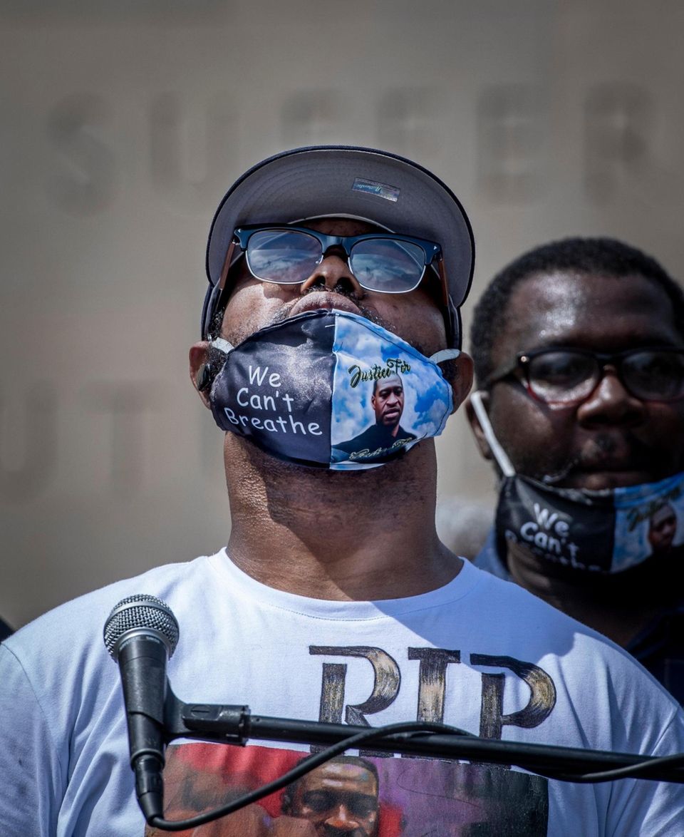 Terrence Floyd, center, is emotional while speaking to
