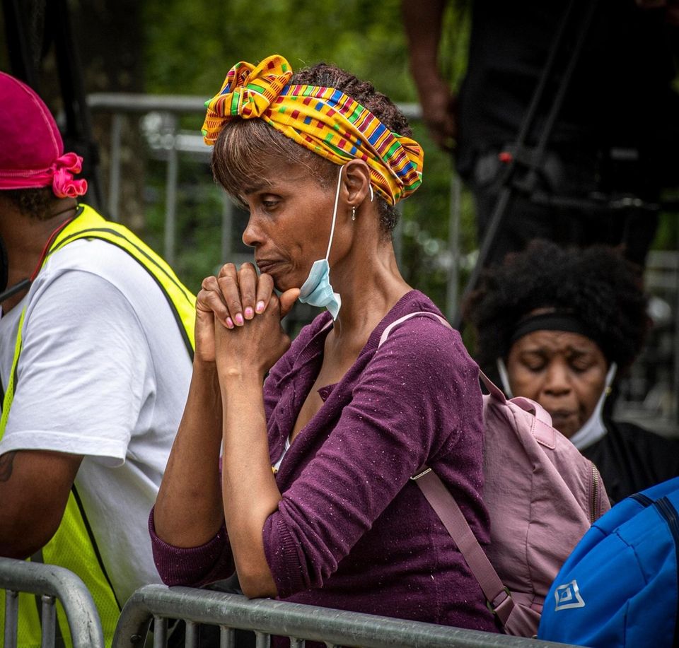 A woman appears to praying before the start
