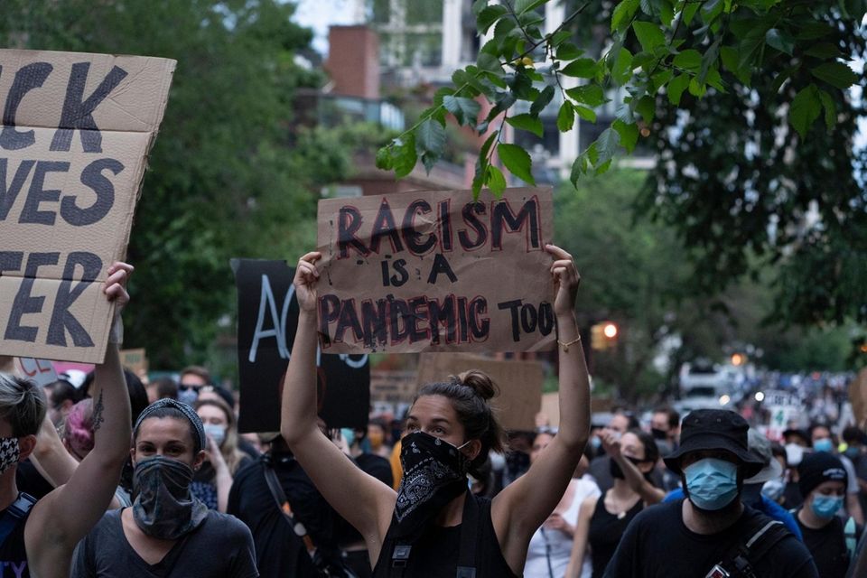 Demonstrators protest on East End Avenue next to