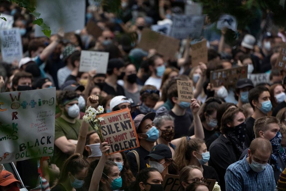 Demonstrators protest on East End Avenue next to